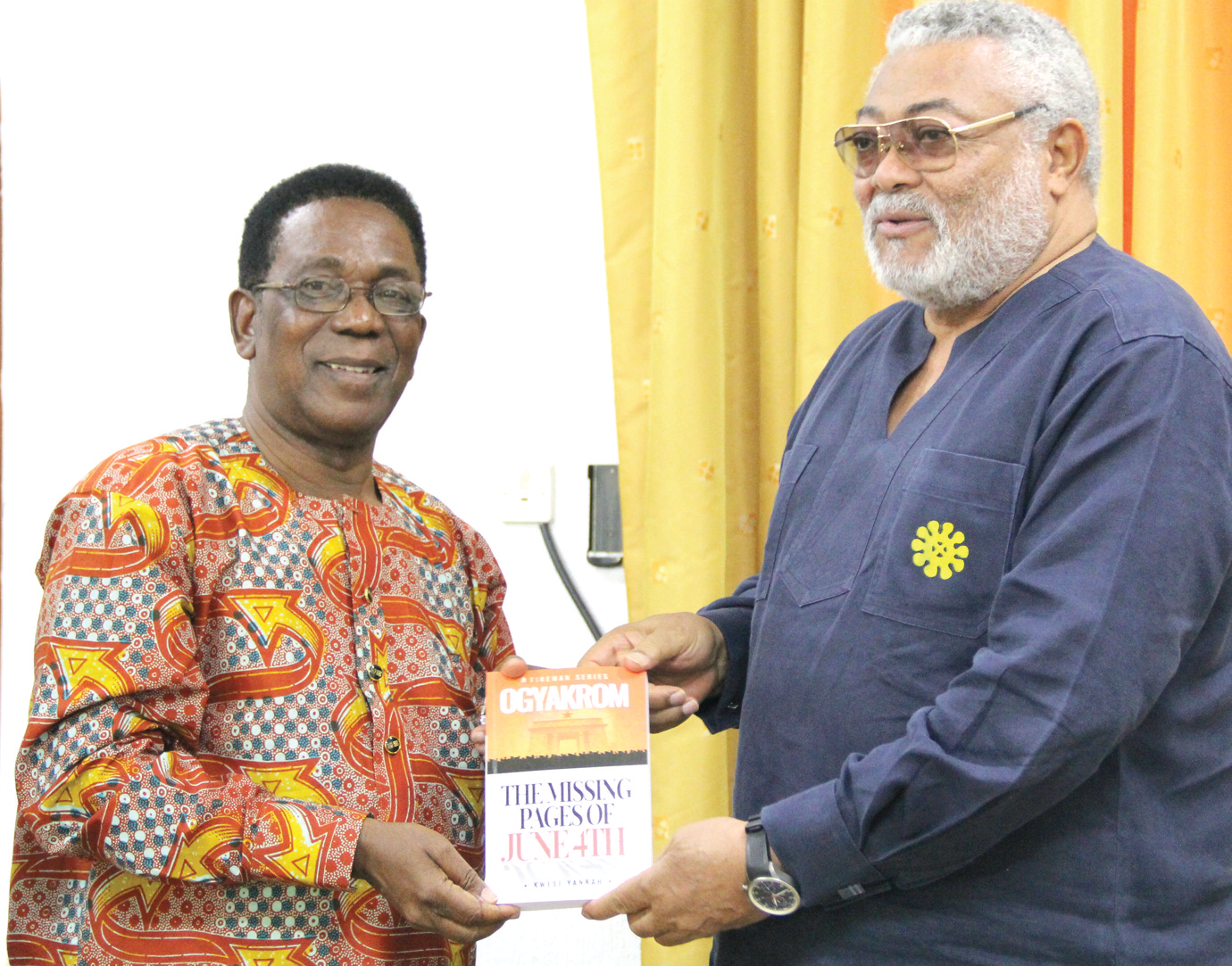 Former President Rawlings receiving a copy of the book from Prof. Kwesi Yankah